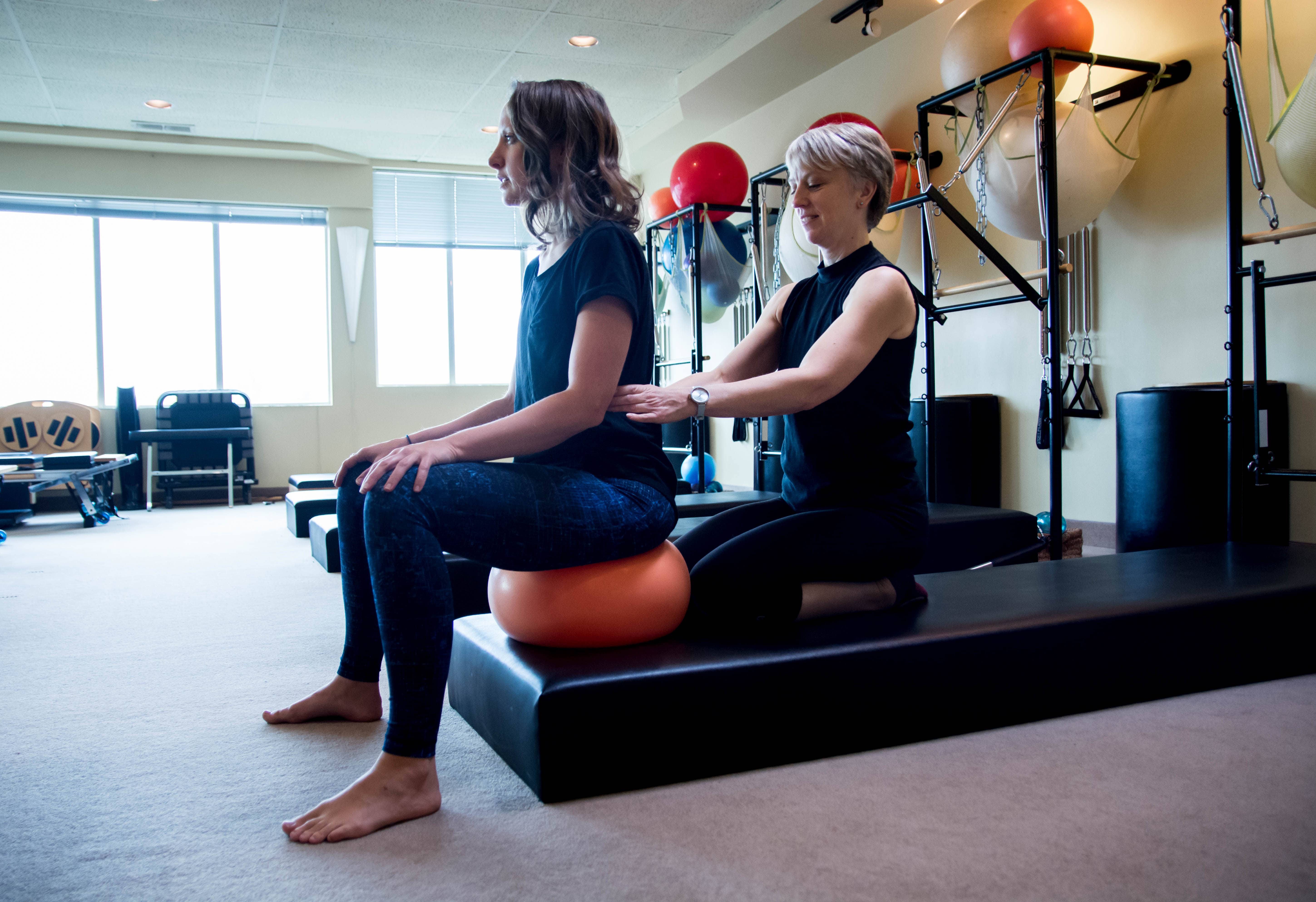 Laura Helsel, Pilates Process Director, Demonstrating A Back Pain Recovery Exercise Laura Helsel, Pilates Process Director, Demonstrating A Back Pain Recovery Exercise